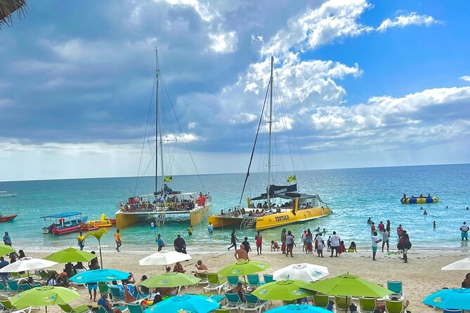 7 Mile Beach Party Catamaran Cruise with Snorkeling & Ricks Cafe - Key highlights worth your time