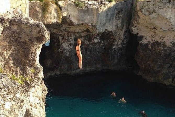 “ATV Adventure & Rick’s Café Experience from Montego Bay - Rick’s Café in Negril: music, a 35-foot cliff scene, and sunset odds