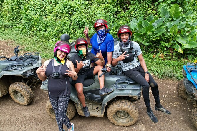 ATV, Bamboo Rafting and Negril Ricks Cafe from Montego Bay - Green Island ATV riding: safety briefing first, then muddy fun