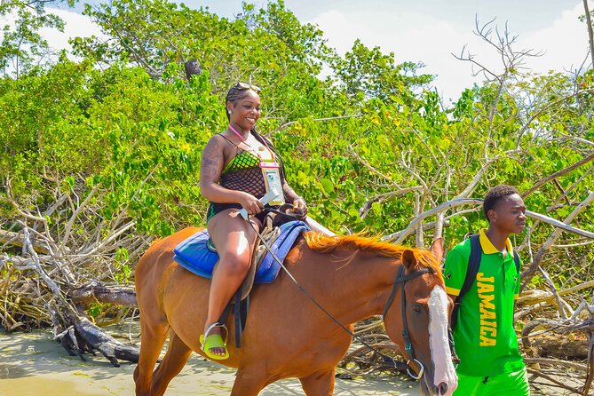 Bamboo Rafting and Horseback Riding Tour Montego Bay Jamaica - Bamboo rafting (about 1 hour 45): calm water with real time