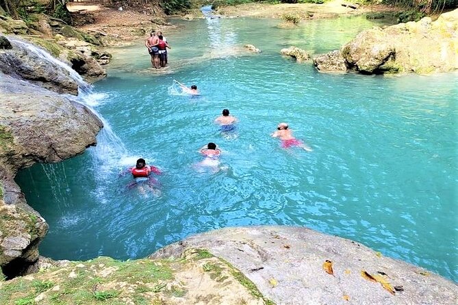 Blue Hole & Secret Falls Day-Trip with Shopping from Grand Palladium - Cool Blue Hole: mineral water, rope swings, and the jump-off fun