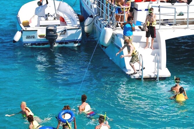 Catamaran Party Cruise and Snorkeling from Montego Bay - Margaritaville Stop: Water Slides, Inflatable Fun, and a Ticketed Visit