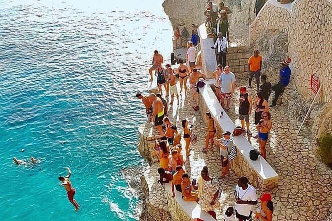 Full Day Tour of Negril Beach: Margaritaville & Rick's Cafe Live - Rick’s Cafe: sunset views, DJ energy, and cliff-jump excitement