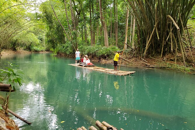 Martha Brae Bamboo River Rafting With Transportation - The bamboo raft experience: gentle water and a real captain