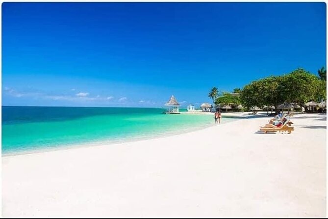 Negril Seven Miles Beach, Snorkeling, Boat Ride, Ricks Cafe Combo - Margaritaville and local snack stops: entertainment and sugar-cane Juici Patties