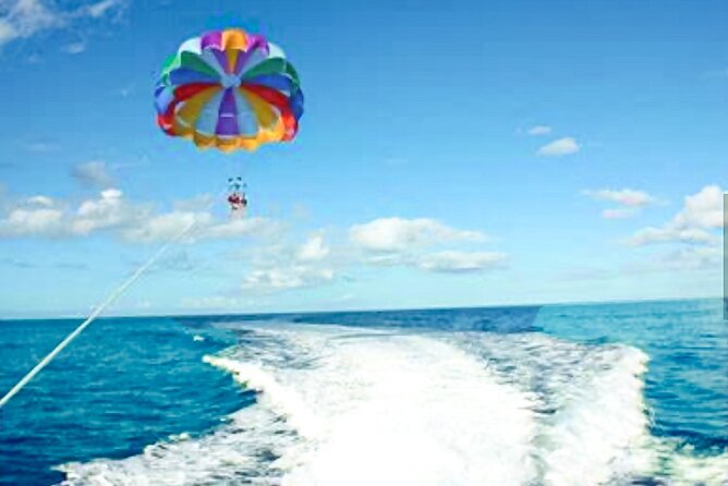 Parasailing above Turquoise Ocean Waters in Montego Bay - After You Land: Beach Atmosphere and a Quick Swim Moment