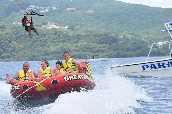 Parasailing, Sea Tubing & Jet Ski from Montego Bay- Private tour - Sea tubing behind a speedboat: the thrill part
