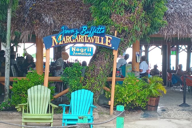 Seven Miles Beach in Negril and Ricks Cafe from Montego Bay - Rick’s Café: Sunset, Music, and the Cliff Jump Moment