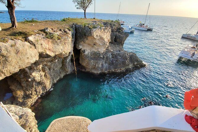 Sunset Catamaran cruise, Snorkeling and Rick's Cafe from Mobay - Rick’s Cafe: The Sunset Show with Cliff-Jumping as an Option